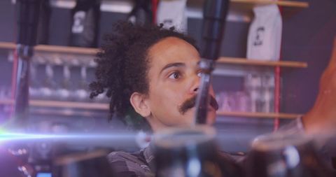 Barista Crafting Beverages in Busy Cafe Setting