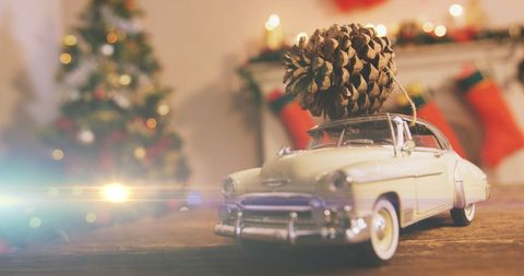 Vintage Car with Pine Cone Decoration in Holiday Setting - Download Free Stock Images Pikwizard.com