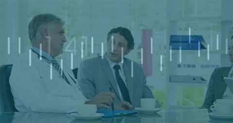 Healthcare professionals discussing data in office meeting room