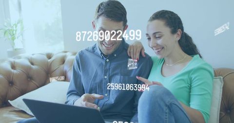 Couple Managing Finances on Laptop with Digital Sequences