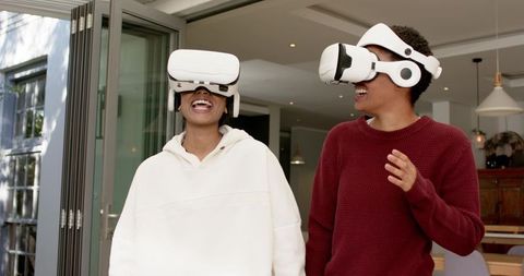 Young Adults Experiencing Virtual Reality Together Indoors