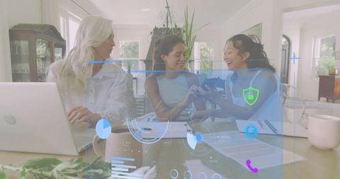 Multigenerational women collaborating over phone and laptop with augmented reality overlay