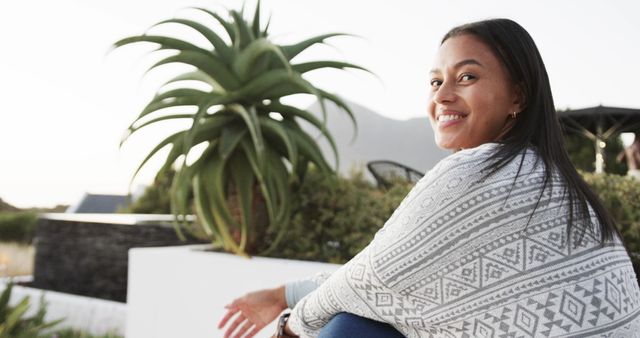 Smiling Woman Relaxing Outdoors with Scenic Mountain View - Download Free Stock Images Pikwizard.com