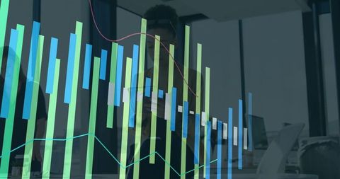 Businessperson analyzing financial charts with overlayed graphs