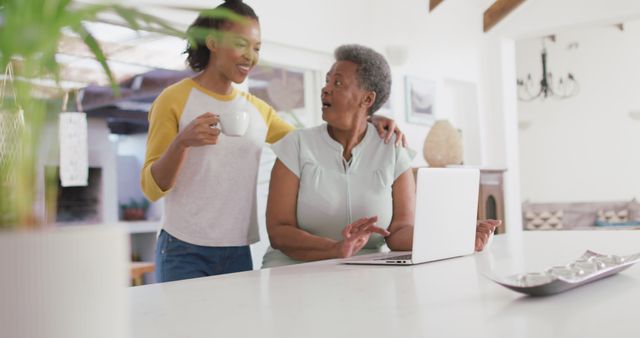 Senior Woman Using Laptop with Adult Daughter at Home - Download Free Stock Images Pikwizard.com