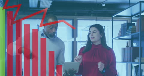 Diverse Colleagues Analyzing Financial Data on Tablet in Office