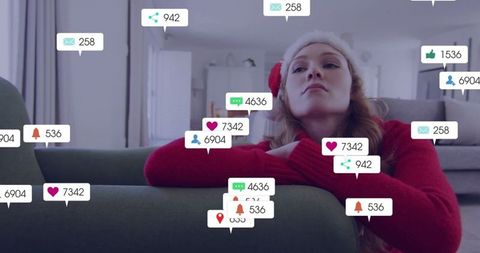 Woman In Santa Hat With Increase in Social Media Notifications