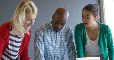 Diverse Team Collaborating on Project in Casual Office Environment - Download Free Stock Images Pikwizard.com