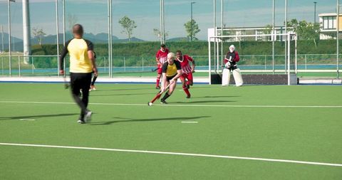 Athletes Playing Field Hockey on Synthetic Turf