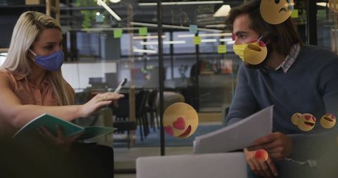 Coworkers Collaborating with Masks in Modern Workspace