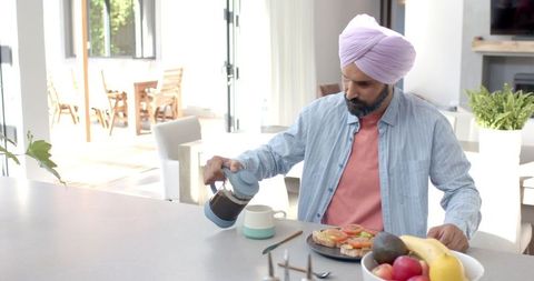 Man in Turban Enjoying Morning Coffee and Breakfast at Home