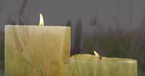 Warm Candlelight Reflecting Hope in Peaceful Natural Setting