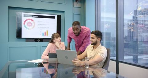 Diverse Business Team Analyzing Project in Modern Office Setting