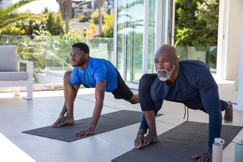 Father and Son Exercising Together Outdoors