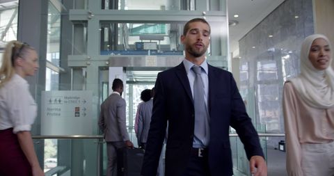 Diverse Business Professionals Walking in Office Hallway - Download Free Stock Images Pikwizard.com