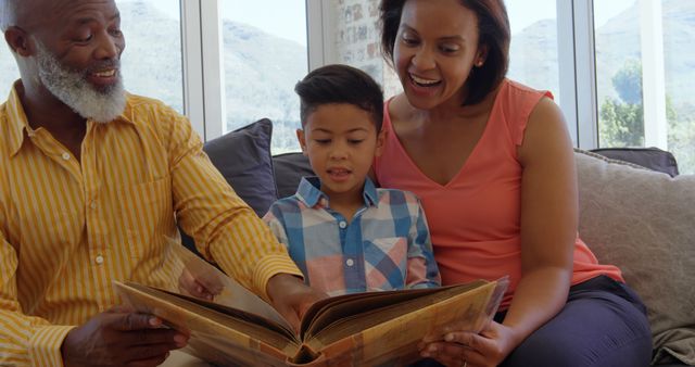 Family Bonding Time with Grandfather Reading Storybook to Grandson - Download Free Stock Images Pikwizard.com