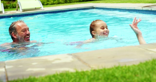 Father and Daughter Enjoying Swim in Outdoor Pool on Sunny Day - Download Free Stock Images Pikwizard.com