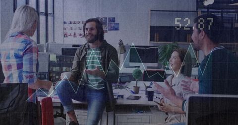 Creative Office Meeting Overlaid with Financial Data Visualization