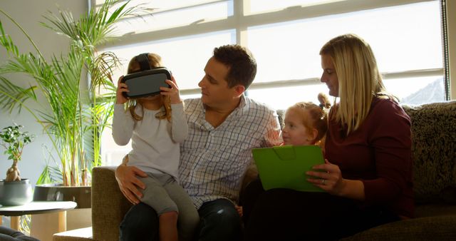 Family Enjoying Virtual Reality and Digital Tablet Together - Download Free Stock Images Pikwizard.com