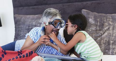 Grandmother and Granddaughter Bonding with Snorkel Gear
