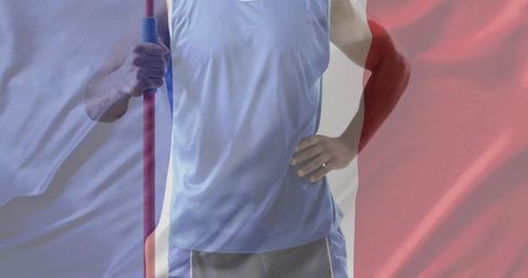 Athlete torso holding red pole with blue grip, flag overlay and wedding ring