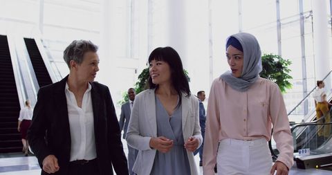 Diverse Businesswomen Collaborating in Modern Lobby - Download Free Stock Images Pikwizard.com