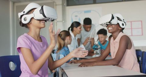 Kids Learning with Virtual Reality Headsets in Classroom