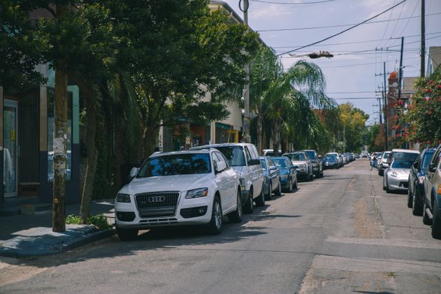 Urban Residential Street with Parked Cars on a Sunny Day - Download Free Stock Images Pikwizard.com