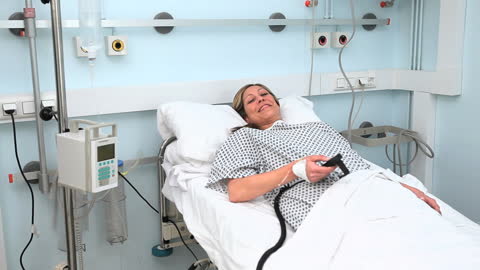 Smiling Patient Relaxing in Hospital Bed