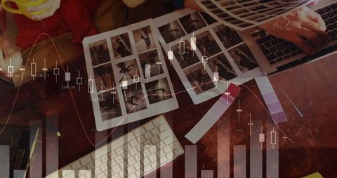 Analyzing Financial Data with Technology and Printed Charts - Download Free Stock Images Pikwizard.com