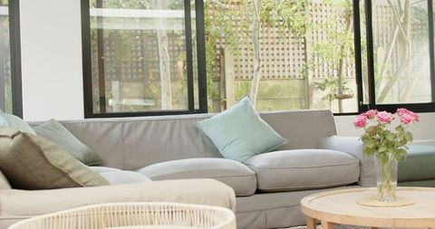 Modern Living Room with Grey Sofa and Garden View