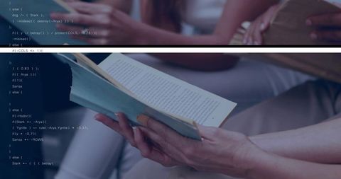 Holding turning paperback pages in study group with overlaid code and soft bokeh