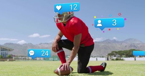 Kneeling football player wearing red jersey holding ball with digital social media badges
