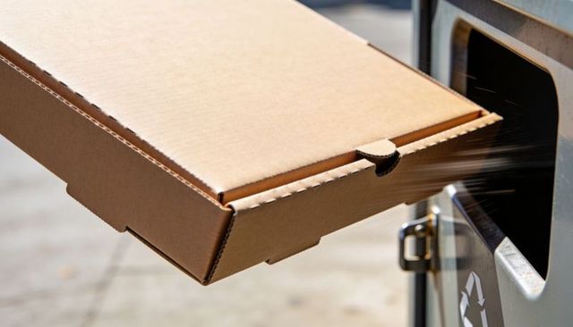 Sliding Corrugated Takeout Box Entering Curbside Recycling Bin, Urban Recycling Concept