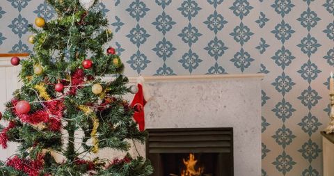Cozy Christmas Tree by Fireplace with Festive Decorations - Download Free Stock Images Pikwizard.com