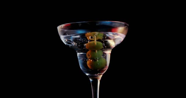 Elegant Martini Glass with Olives against Dark Background - Download Free Stock Images Pikwizard.com