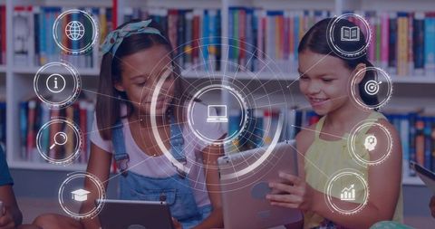 Girls using tablets in library with futuristic hud icons representing edtech learning