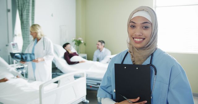 Smiling Muslim Nurse in Hospital Ward Attending Patients - Download Free Stock Images Pikwizard.com