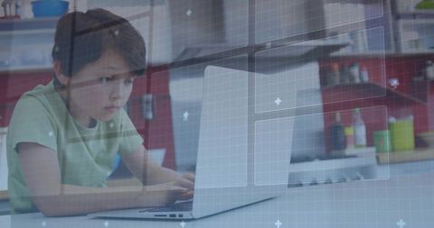 Focused Young Child Using Laptop for Digital Learning at Home