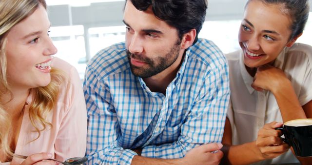 Group of Young Professionals Smiling and Having a Discussion in Office - Download Free Stock Images Pikwizard.com