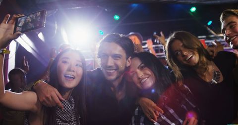 Diverse Young Adults Taking Selfie at Vibrant Party - Download Free Stock Images Pikwizard.com