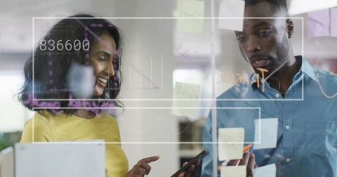 Team Collaborating on Financial Data with Digital Interface