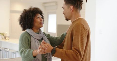 African American Couple Dancing in Modern Kitchen Sharing Tender Romantic Moment