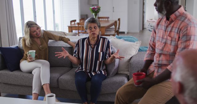 Diverse Multi-Generational Group Having Lively Conversation in Living Room - Download Free Stock Images Pikwizard.com