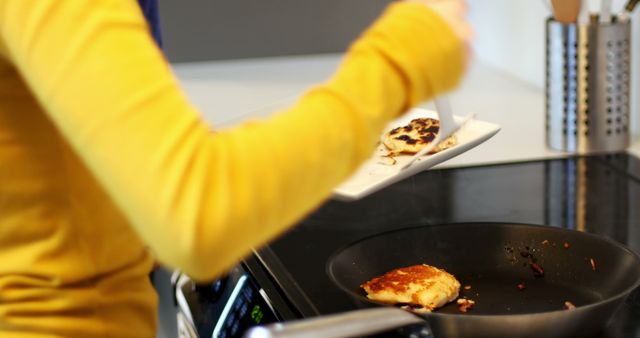 Person Cooking Chicken Fillets in Modern Kitchen - Download Free Stock Images Pikwizard.com