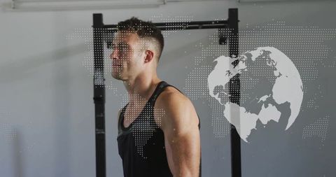 Athlete preparing for pull-up set in minimal gym with digital globe fitness overlay