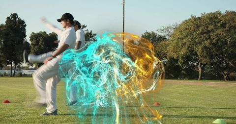 Cricket players warming up with dynamic cyan and amber energy swirl on grassy field
