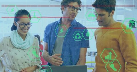 Team Collaborating Over Laptop With Augmented Reality Analytics Overlay in Open Office