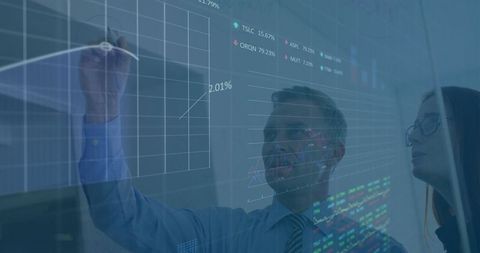 Business Professionals Analyzing Data on Glass Board