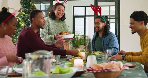 Diverse Friends Enjoying Festive Dinner Together